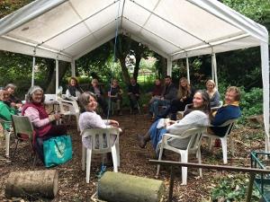 Volunteer sitting in gazeebo